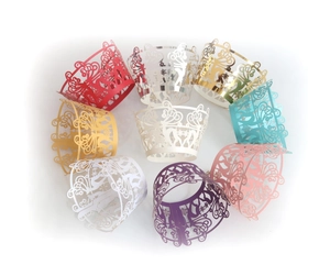 Detailed laser-cut cupcake wrappers with reindeer and snowflake patterns in various colors