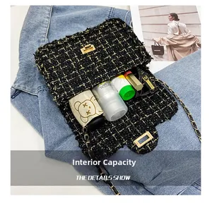 Detail view of tweed chain bag interior capacity with cosmetic items and mini umbrella