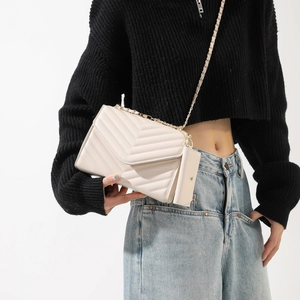 Chic beige chevron quilted crossbody bag with gold chain and matching mini pouch accessory