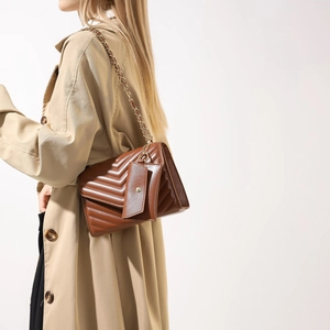 Brown quilted PU leather crossbody bag with gold chain strap and small pouch charm