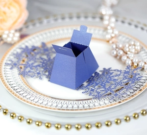 Navy blue pearl paper snowflake candy box with laser-cut hollow design for Christmas party