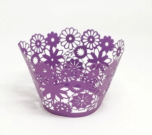 Intricate laser-cut purple floral cupcake wrappers with hollow sunflower paper patterns