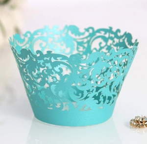 Detail of Tiffany blue lace cupcake wrapper with intricate laser-cut floral pattern