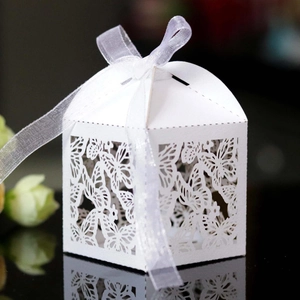 Detailed laser-cut butterfly gift box with elegant white ribbon and intricate hollow pattern