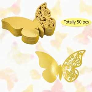 Detailed close-up of 50pcs laser-cut golden butterfly seat cards for wedding table decor