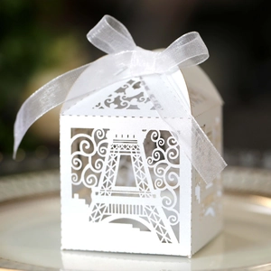 Detailed laser cut Eiffel Tower white favor box with elegant organza ribbon bow