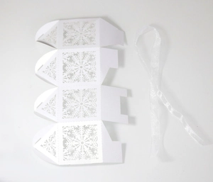 Detailed laser-cut snowflake hollow gift box with elegant white silk ribbon set