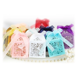 Elegant laser-cut butterfly wedding candy gift boxes with ribbon in various colors