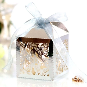 Silver laser cut candy box with butterfly patterns and blue organza ribbon bow
