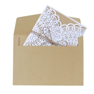 Rustic laser-cut wedding invitation set with kraft envelope and natural twine bow