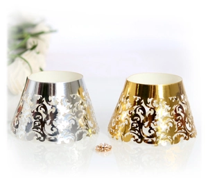 Detailed laser-cut vine patterns on gold and silver metallic cupcake wrappers