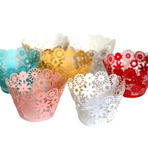 Laser-cut hollow floral cupcake wrappers in multiple vibrant colors for party decorations