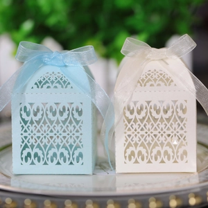 Detailed laser-cut hollow pattern on pearl paper wedding candy gift boxes with organza ribbons