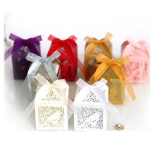 Golden laser-cut lovebird candy box with organza ribbon for weddings and parties