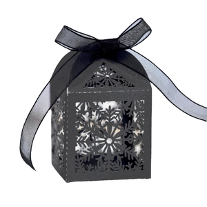 Black laser-cut snowflake gift box with ribbon bow, house-shaped for Christmas sweets