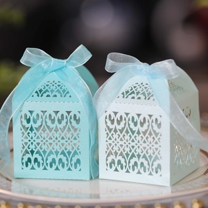 Detailed laser-cut hollow pattern on cyan and light blue paper wedding gift boxes