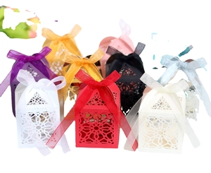 Laser-cut hollow candy boxes with silk ribbons in multiple colors for weddings