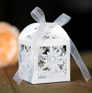 White laser cut snowflake candy box with ribbon for weddings and Christmas gifts