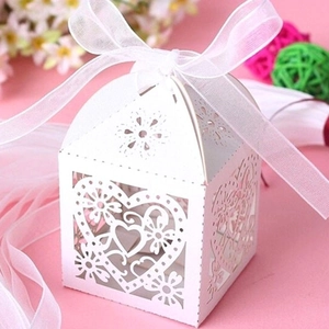 White laser-cut heart favor box with organza ribbon for weddings and Valentine's Day