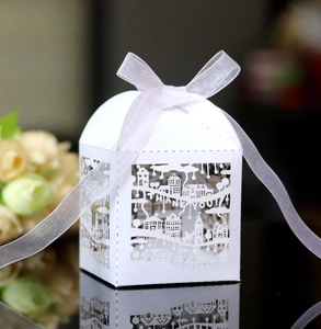 White laser-cut Thank You gift box with festive town motifs and white organza ribbon