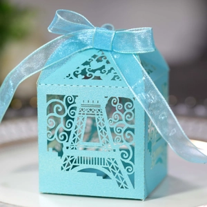 Detailed laser-cut Eiffel Tower favor box in light blue with elegant ribbon bow