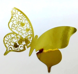 Detailed view of hollowed-out butterfly place card in shiny gold metallic finish