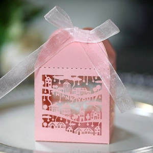 Detailed view of pink laser-cut hollow gift box with Thank You text and white ribbon bow