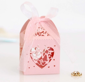 Pink laser-cut hollow heart candy gift box with LOVE design and ribbon for wedding