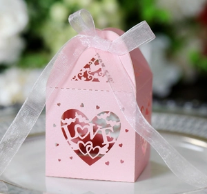 Detailed view of pink镂空wedding gift box featuring LOVE heart cutout and organza ribbon