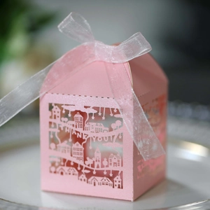 Pink laser-cut gift box featuring cityscape silhouettes and Thank You text with ribbon