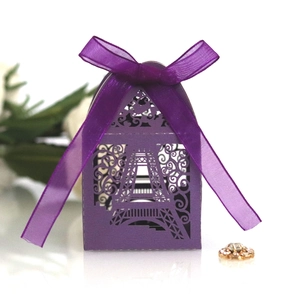 Detailed laser-cut purple candy box featuring Eiffel Tower patterns and organza ribbon