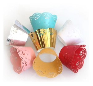 Laser cut lace cupcake wrappers in multiple colors with floral patterns for party decoration