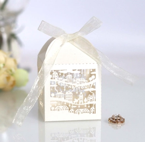 Detail of white laser-cut gift box with THANK YOU text and elegant ribbon bow
