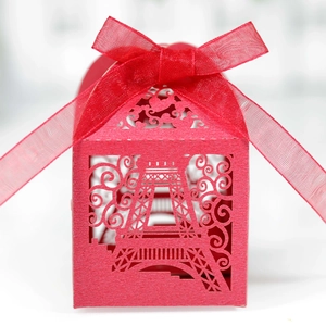 Detailed laser-cut Eiffel Tower pattern on red pearlescent paper wedding favor box