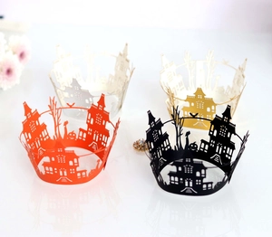 Laser-cut Halloween cupcake wrappers featuring spooky castles, trees, and pumpkins