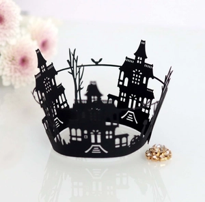 Laser-cut Halloween cupcake wrapper with black castle and spooky bird silhouette