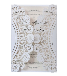 Detailed laser cut white wedding invitation lace design with insert card and fine texture