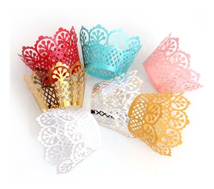 Laser cut floral cupcake wrappers in various colors for elegant dessert table decoration
