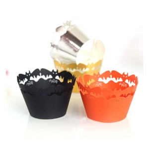 Laser-cut Halloween cupcake wrappers featuring intricate black bat hollow designs
