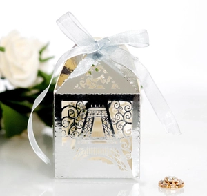Laser-cut silver Eiffel Tower candy box with blue ribbon for wedding favors