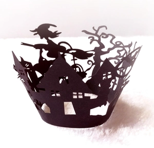 Halloween cupcake wrappers featuring black laser-cut haunted castle and witch silhouette