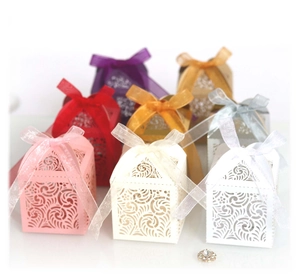 Laser-cut hollow candy boxes with organza ribbons in various colors for wedding favors