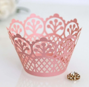 Pink laser-cut lace crown cupcake wrapper with floral lattice design for cake decoration