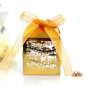 Detail of golden laser-cut gift box with Thank You text and orange organza ribbon