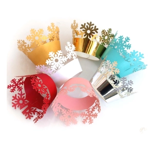 Laser cut snowflake cupcake wrappers in gold, silver, red, white, pink and teal colors