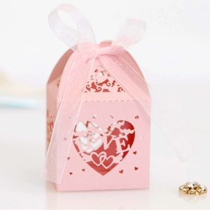 Pink laser cut heart shaped candy box with LOVE engraving and matching ribbon bow