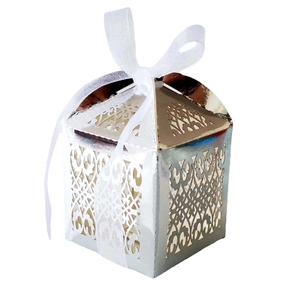 Detail of laser-cut wedding candy box with metallic finish and white ribbon bow