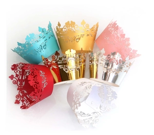 Set of laser-cut cupcake wrappers with crown design in six vibrant metallic colors