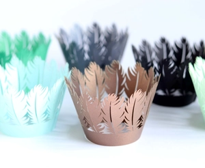 Laser cut feather cupcake wrappers in multiple colors with elegant pearl paper texture