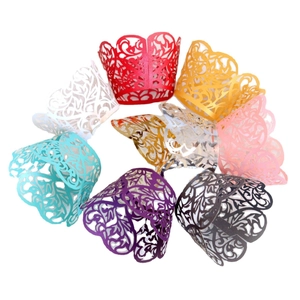 Laser-cut cupcake wrappers with vine lace patterns in various vibrant colors